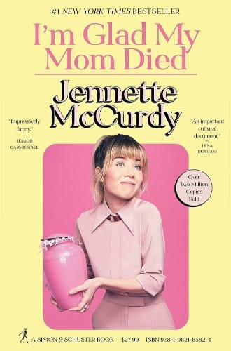 Book cover for "I'm Glad My Mom Died" by Janette McCurdy, featuring the author dressed in pink holding a pink urn.